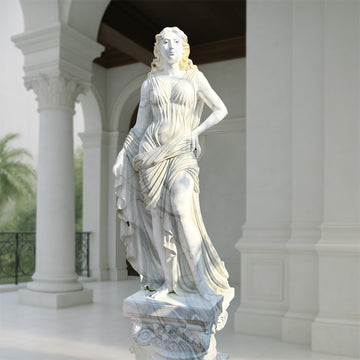Graceful white marble-finish sculpture of a classical lady in flowing drapery, mounted on an ornate pedestal and displayed in a luxurious garden courtyard.