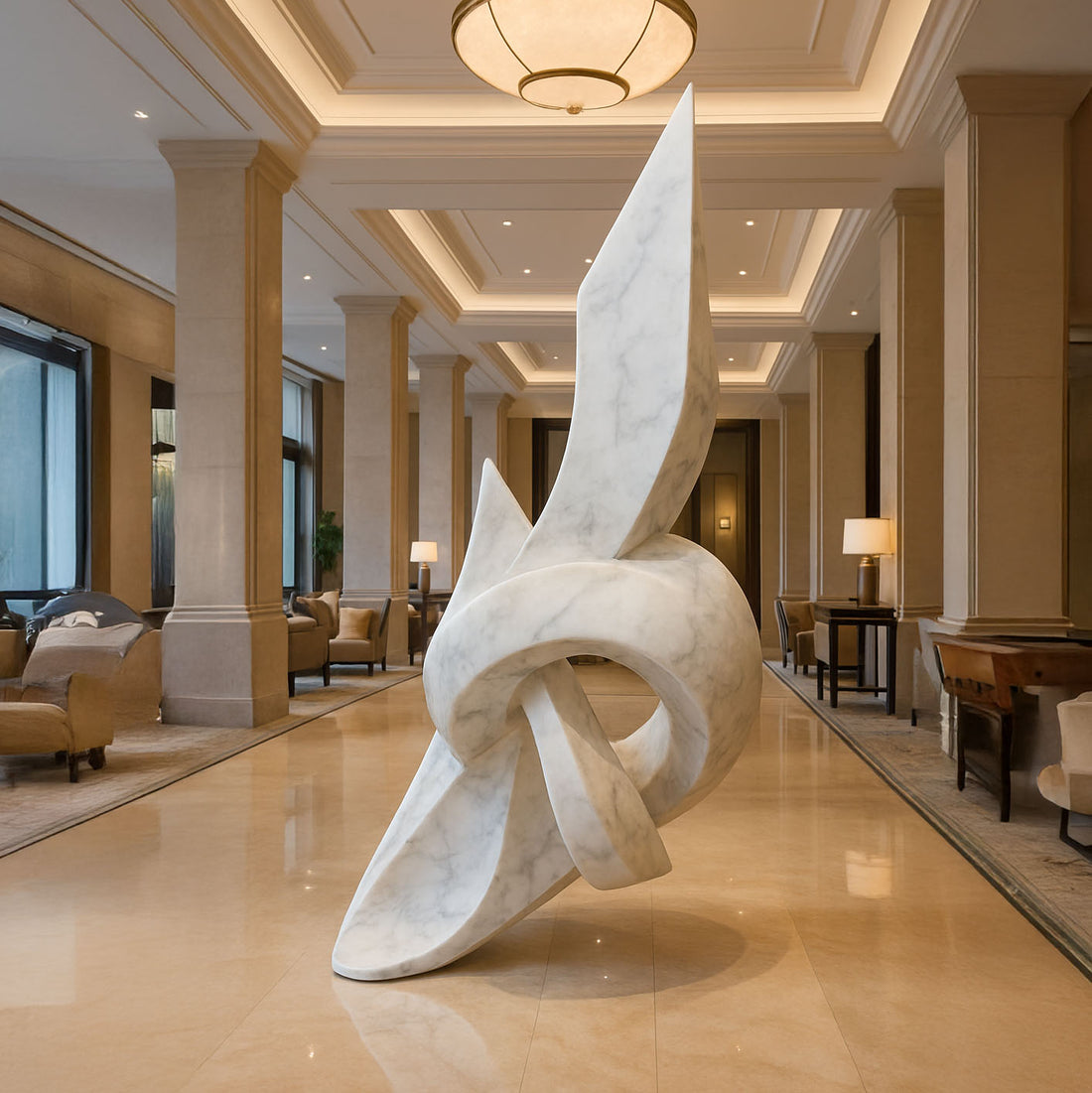 Grand abstract knot-inspired sculpture in a white marble finish with natural veining, displayed in a luxurious hotel lobby with elegant columns and warm ambient lighting.