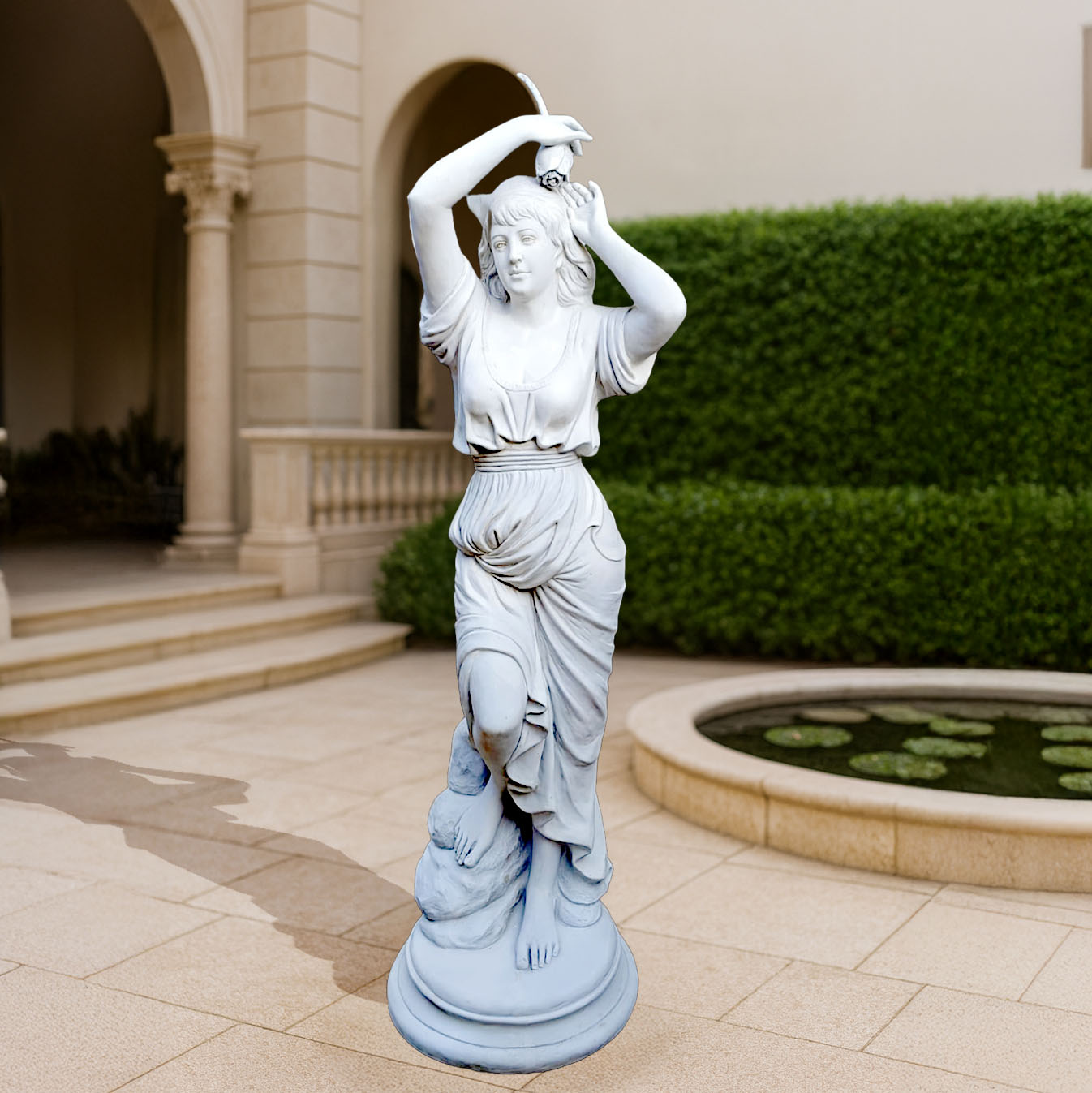 Elegant blue sculpture of a classical dancing lady with detailed drapery, showcased in a grand courtyard with arched architecture and lily pond.
