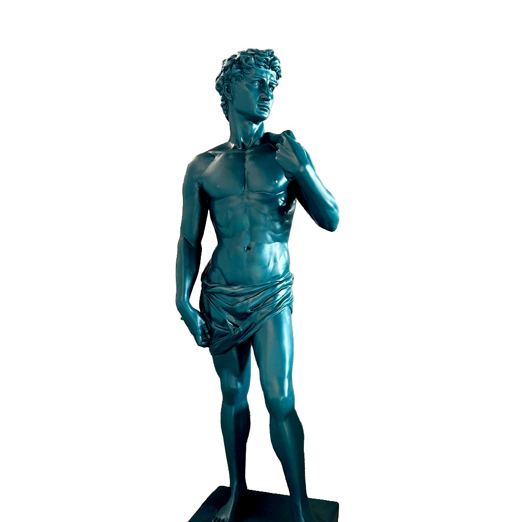 Striking blue metallic finish sculpture inspired by Michelangelo’s David, showcased in a grand outdoor courtyard with classic columns and scenic backdrop.