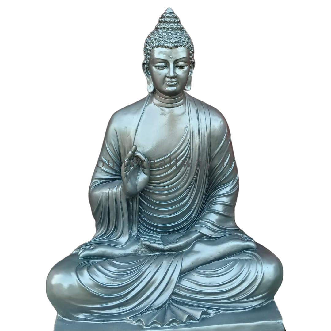 Serene meditating Buddha sculpture in a metallic silver-blue finish, seated in lotus posture on a carved wooden pedestal, with bamboo plants in the background for a peaceful setting.