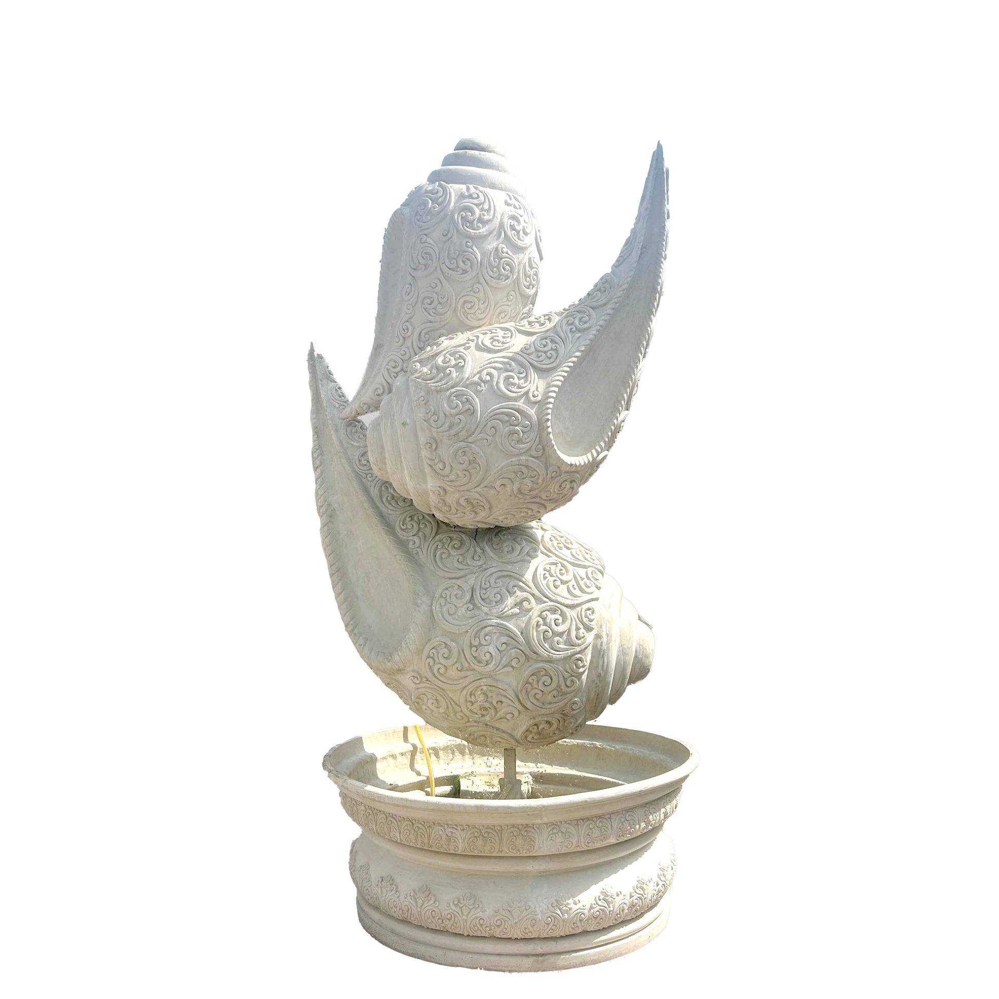 Majestic white marble-finish shankh (conch shell) fountain sculpture with intricate carvings, set on a decorative pedestal basin along a grand garden pathway.