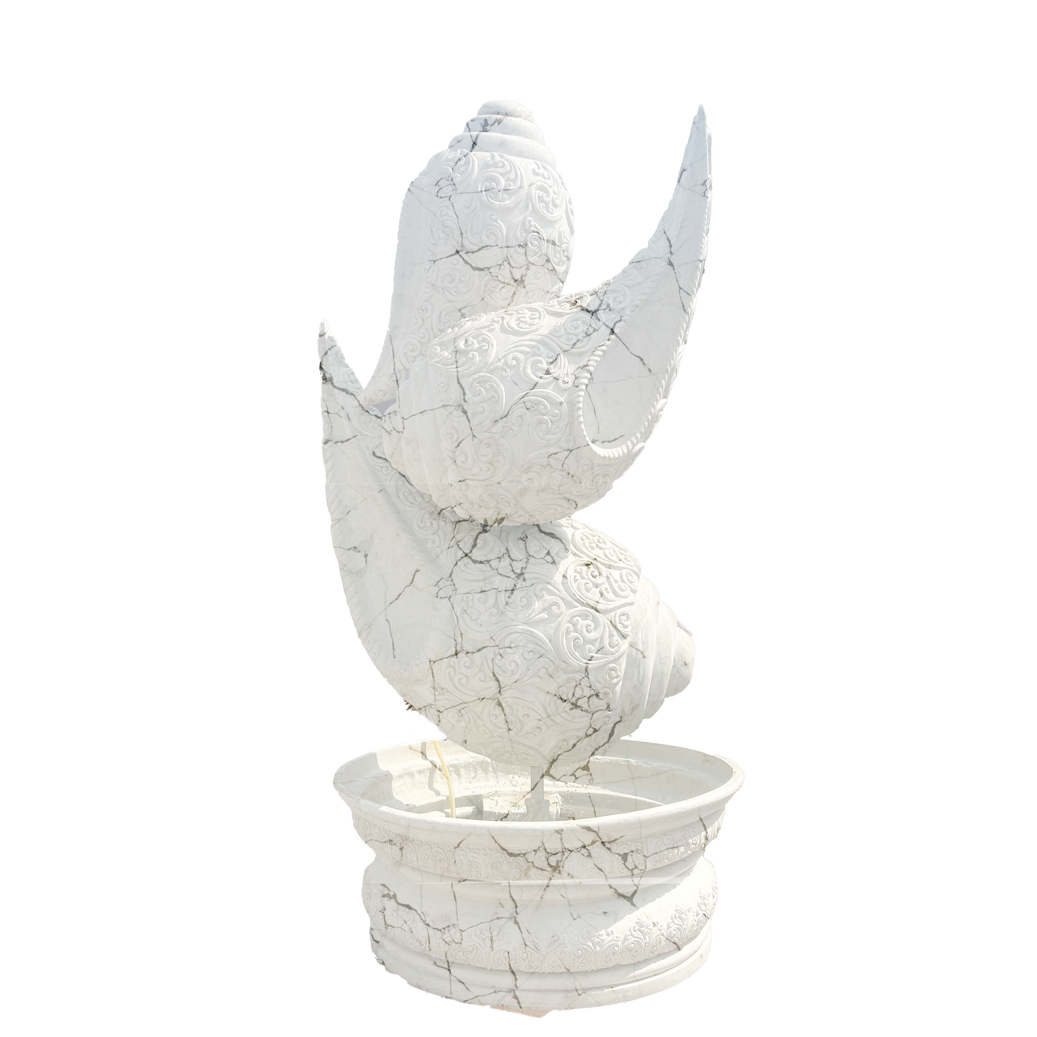 Intricately carved white marble-finish shankh (conch shell) fountain sculpture with detailed textures, placed on a pedestal basin in a luxury garden entrance setting.